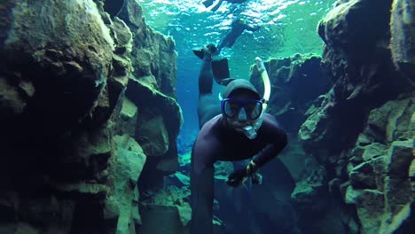Free-diver-in-silfra-Iceland-cold-water-touristic-attraction